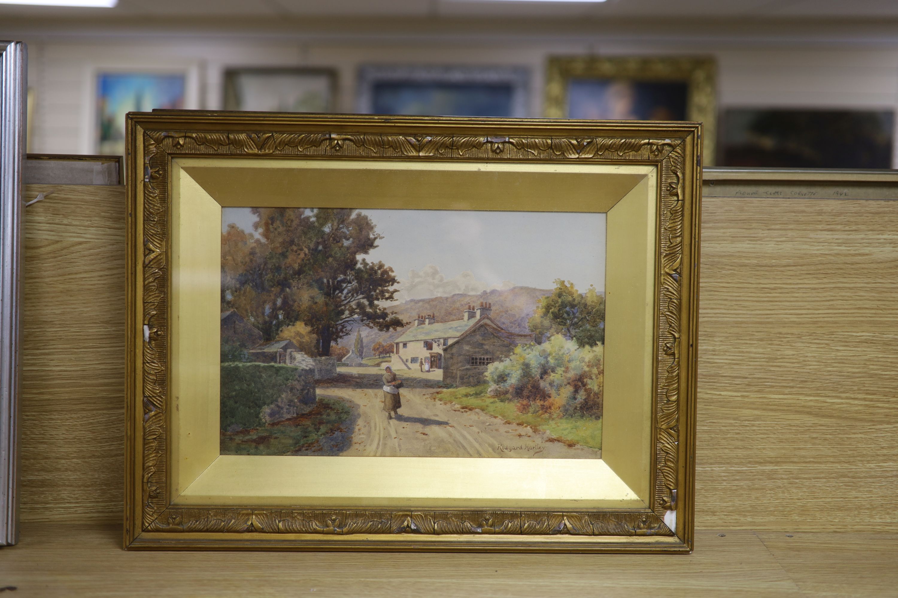 Ridgard Hartley (Exh.1893-1924), watercolour, Figures on a village street, signed, 23 x 36cm